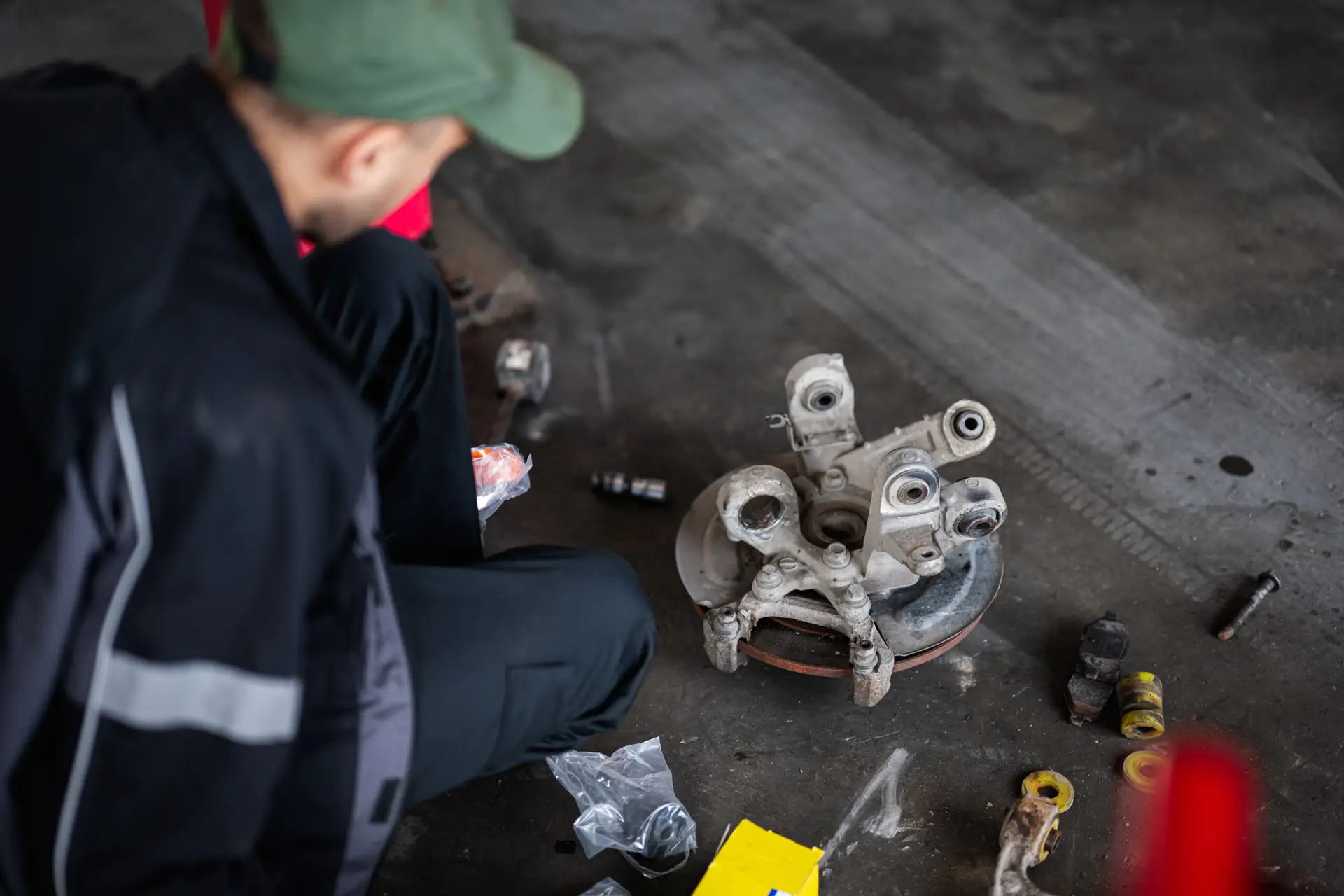 mechanic working on car part in a garage workshop 2025 02 11 09 48 13 utc scaled