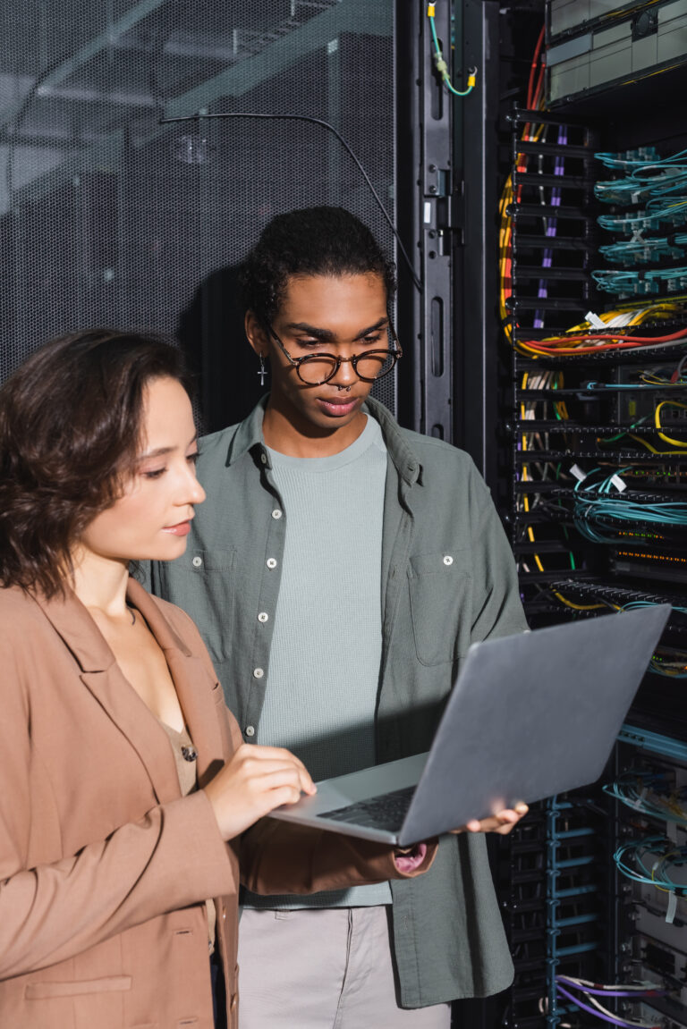 multiethnic technicians working on laptop near ser 2024 11 14 21 28 48 utc scaled