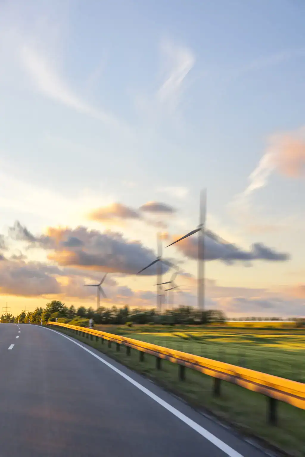 road and wind turbines sunset in motion clean na 2025 07 23 18 47 36 utc scaled